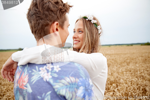 Image of happy smiling young hippie couple outdoors