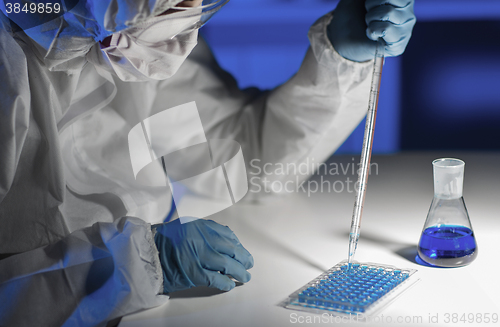 Image of close up of scientist making test in lab