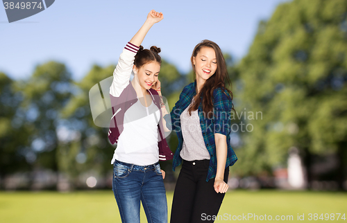 Image of happy smiling pretty teenage girls dancing