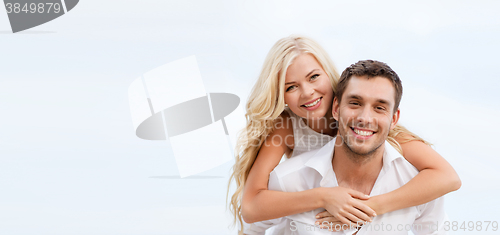 Image of couple having fun on the beach