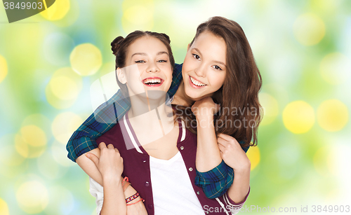 Image of happy smiling pretty teenage girls hugging