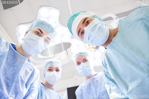 Image of group of surgeons in operating room at hospital