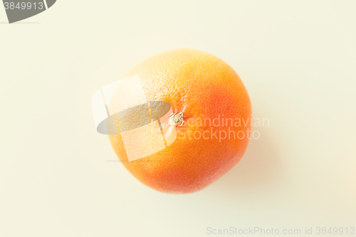 Image of ripe grapefruit over white