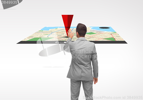 Image of businessman with projection of navigator map