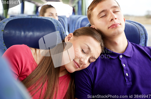Image of happy couple or passengers sleeping in travel bus