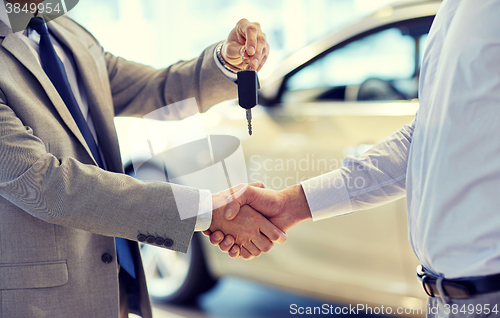 Image of close up of handshake in auto show or salon