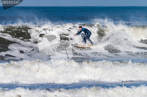 Image of Surfing the waves