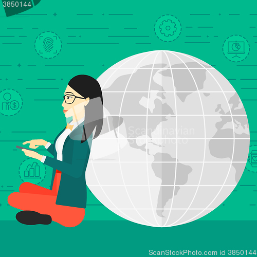 Image of Woman sitting near globe.