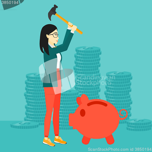 Image of Woman breaking piggy bank.