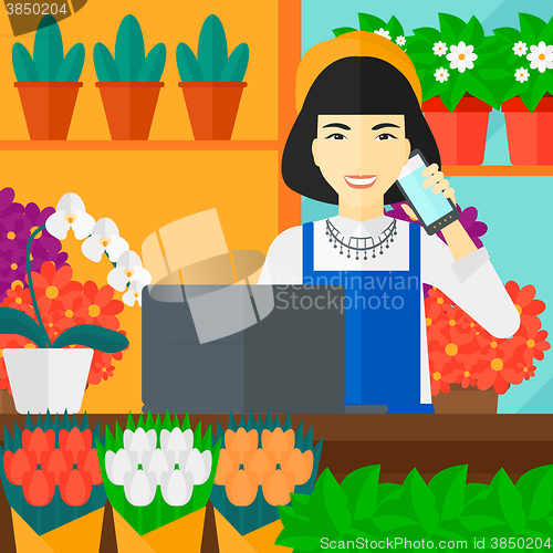 Image of Florist taking order.