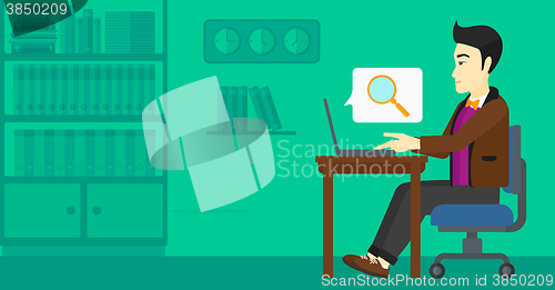 Image of Man working in office.