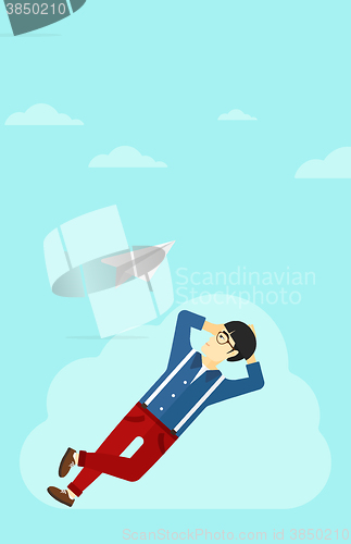 Image of Businessman relaxing on cloud.