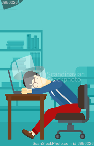 Image of Man sleeping on workplace.