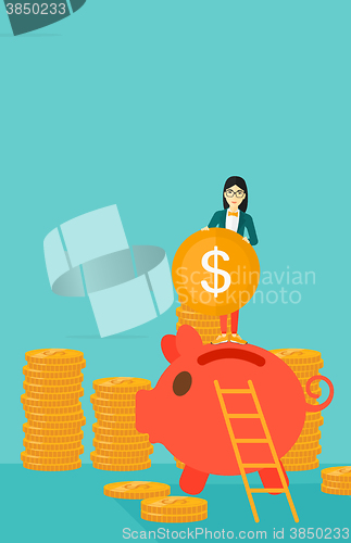 Image of Woman putting coin in piggy bank.