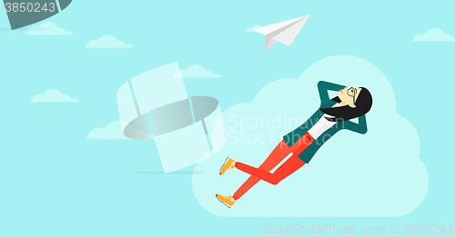 Image of Business woman relaxing on cloud.