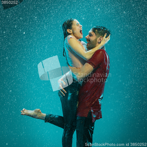 Image of The loving couple in the rain