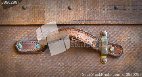 Image of Old canvas trunk handle close up