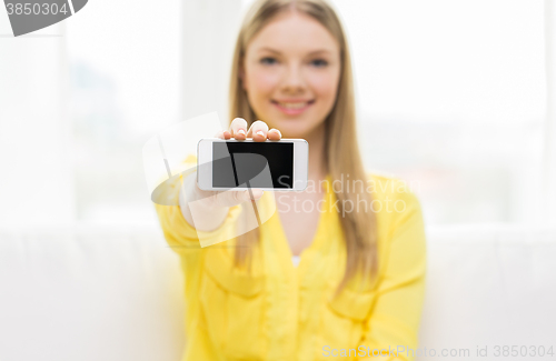 Image of close up of woman showing smartphone blank screen