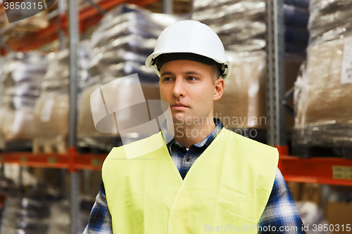 Image of man in hardhat and safety vest at warehouse