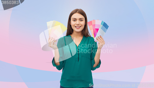 Image of smiling young woman with color swatches