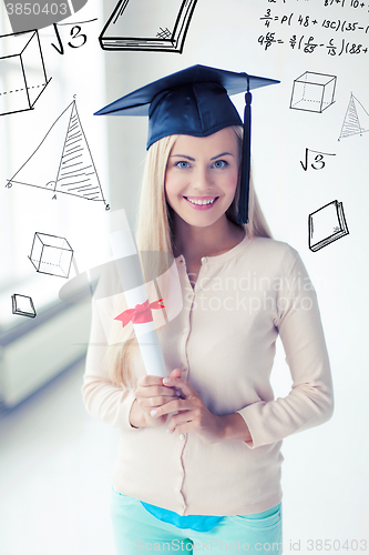 Image of student in graduation cap with certificate