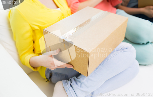 Image of close up of teenage girls with cardboard box