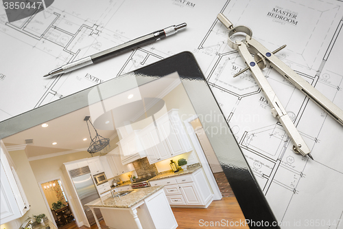 Image of Computer Tablet Showing Finished Kitchen On House Plans, Pencil,