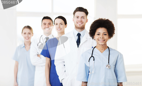 Image of group of happy doctors at hospital