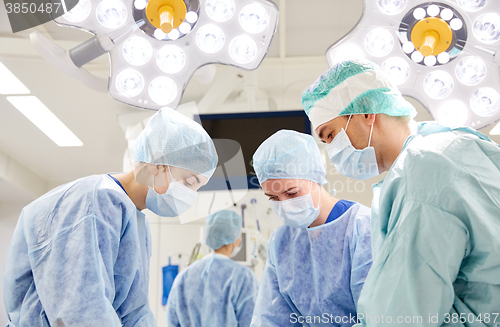 Image of group of surgeons in operating room at hospital