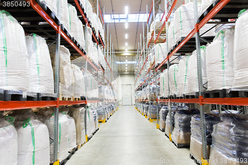 Image of cargo boxes storing at warehouse shelves