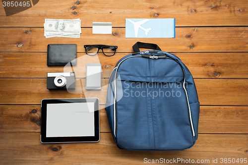 Image of close up of smartphone and travel stuff