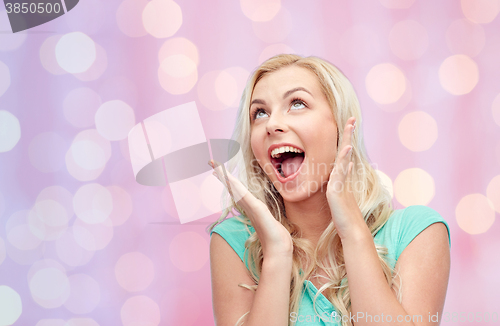 Image of surprised smiling young woman or teenage girl