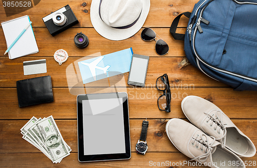 Image of close up of gadgets and traveler personal stuff