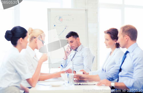 Image of stressed male boss on business meeting