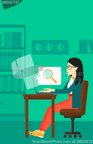 Image of Woman working in office.