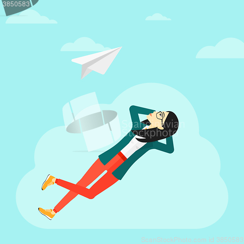 Image of Business woman relaxing on cloud.