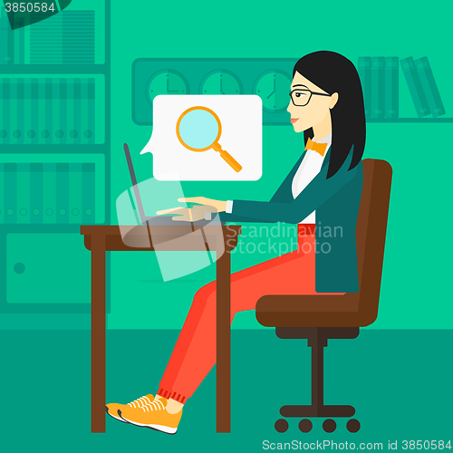 Image of Woman working in office.