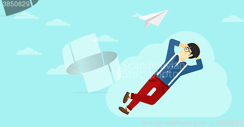 Image of Businessman relaxing on cloud.