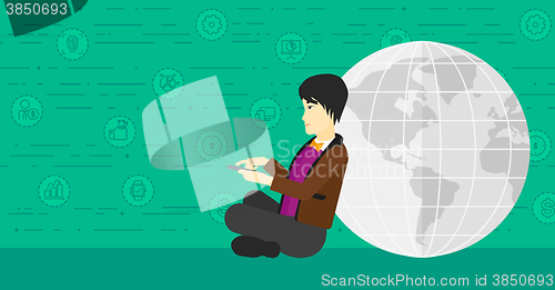 Image of Man sitting near globe.