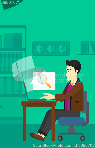 Image of Man working in office.