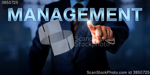 Image of White Collar Professional Pointing At MANAGEMENT