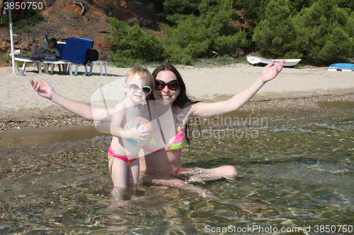 Image of Mother and daughter in same bikinis