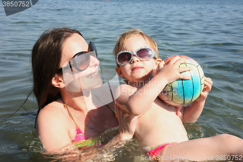 Image of Mother and daughter in same bikinis