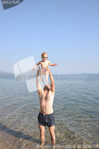 Image of Father playing with his baby girl