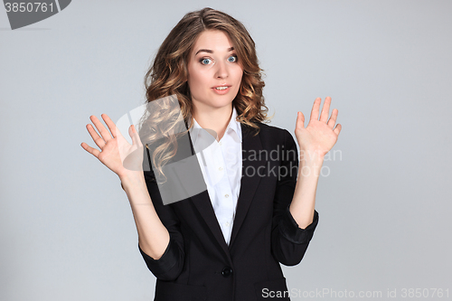 Image of Portrait of young woman with shocked facial expression