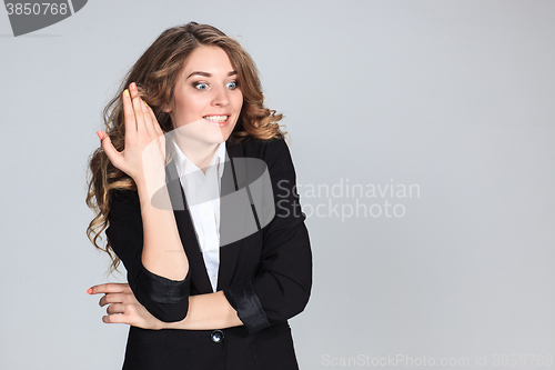 Image of Portrait of young woman with shocked facial expression