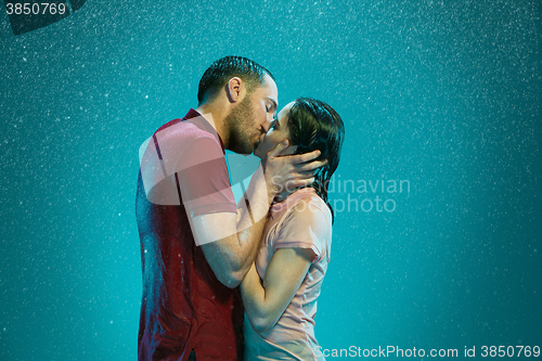 Image of The loving couple in the rain