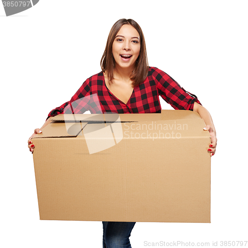 Image of Young woman carrying cardboard box