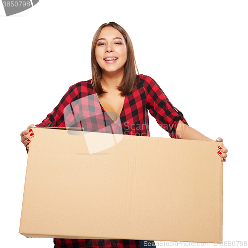 Image of Young woman carrying cardboard box