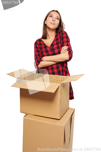 Image of Young woman with cardboard boxes